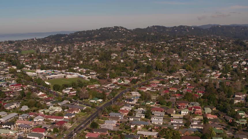 Dense neighborhoods sit below a mountain range