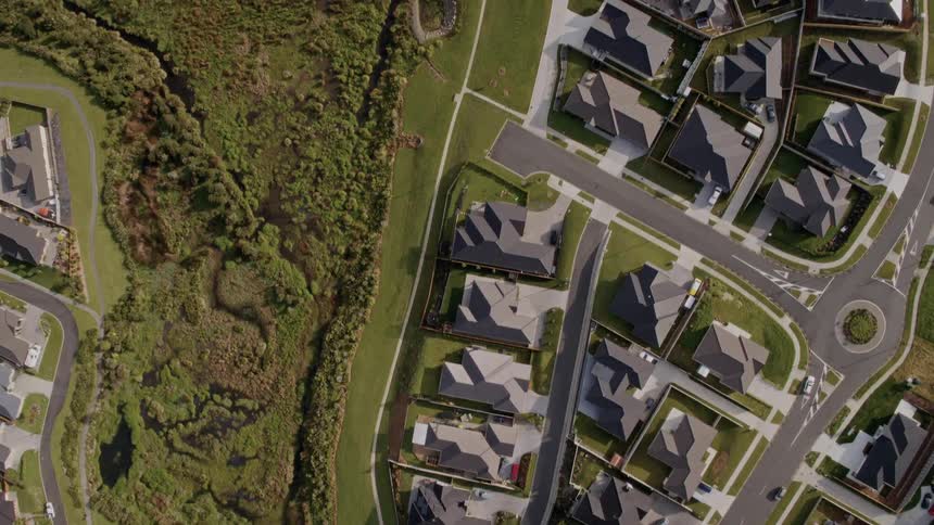Aerial view of detached houses and roads