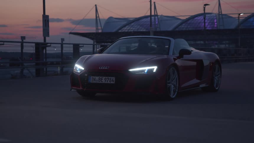 A car driving outdoors on a track