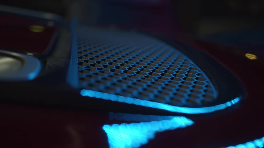 A close up of a speaker cover
