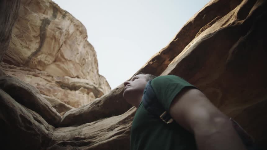 A man hiking outdoors in a canyon