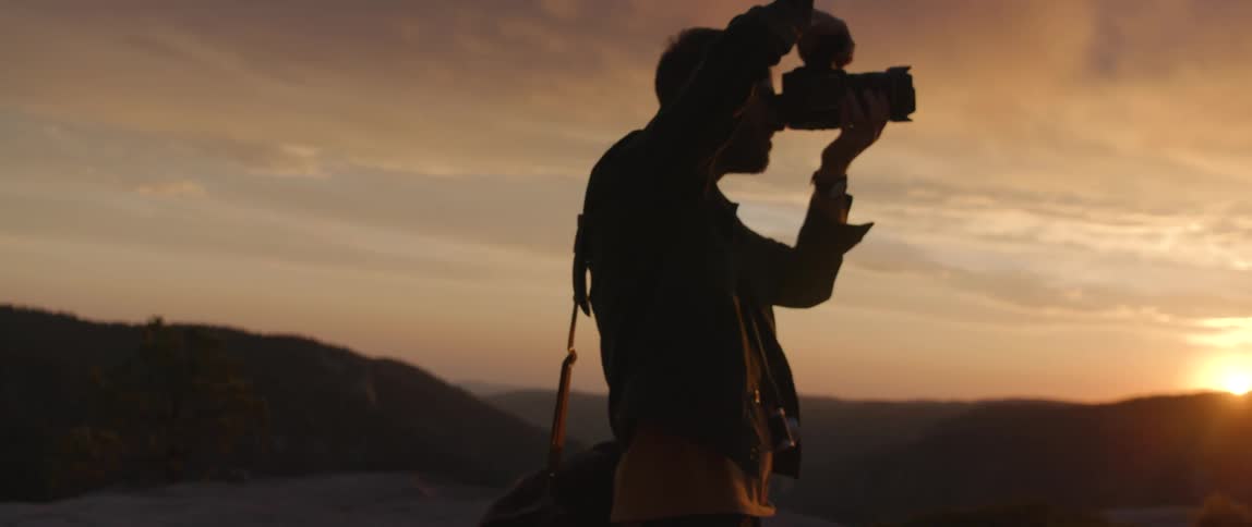 A man taking a photo with a camera