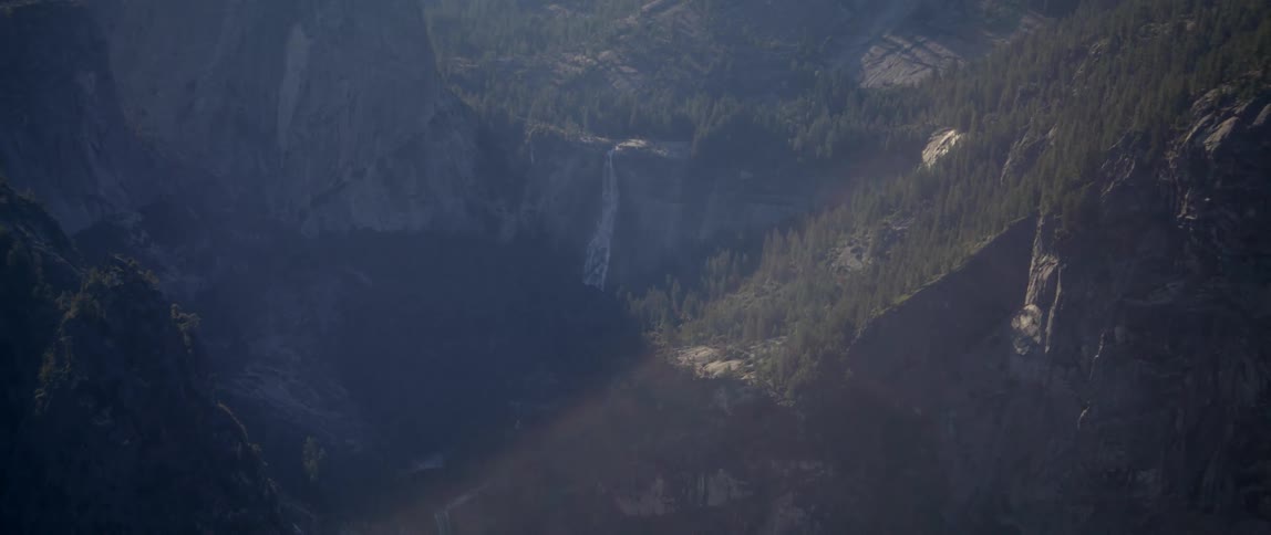Valley sits at the bottom of the tree lined mountains
