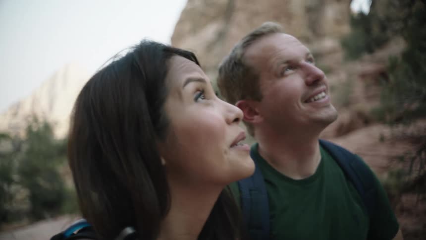 A man and woman hiking outdoors