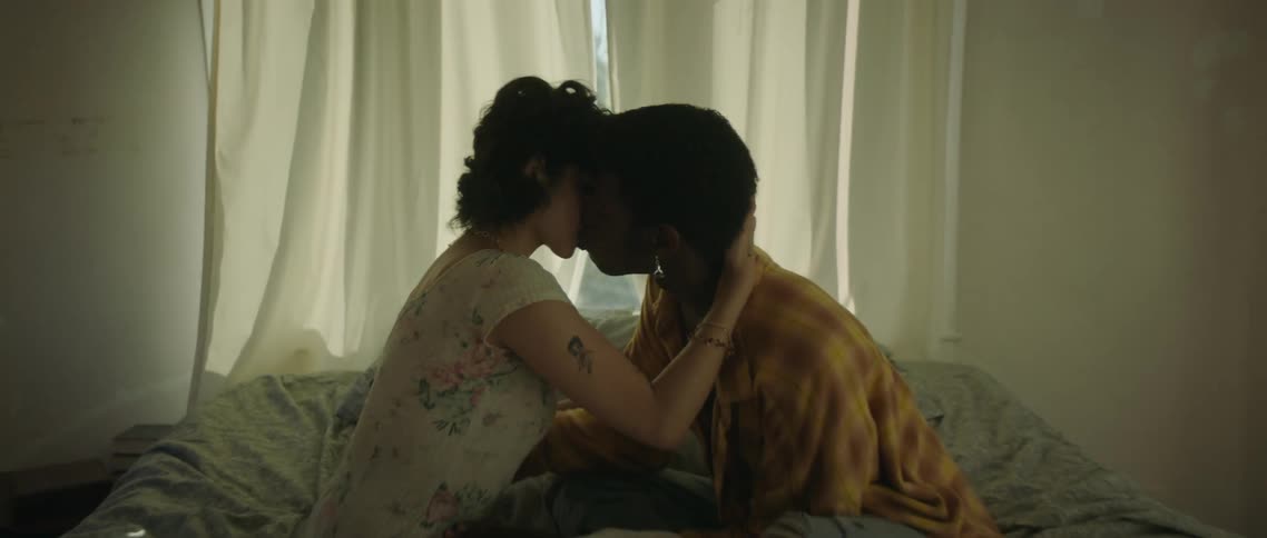 A couple make out in bed