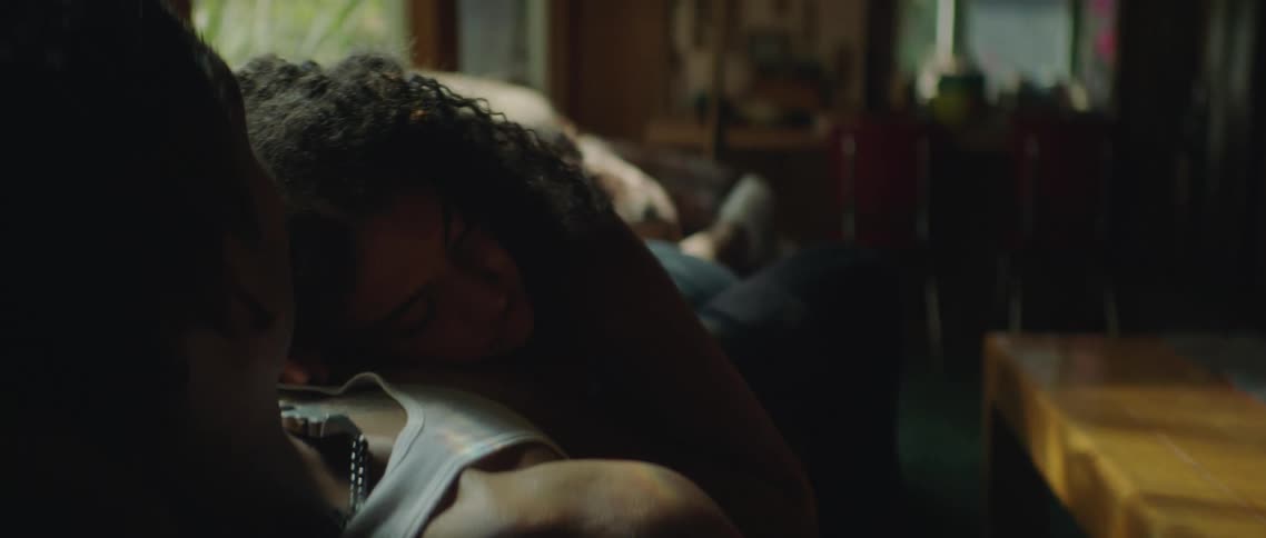 Female lying on mans chest