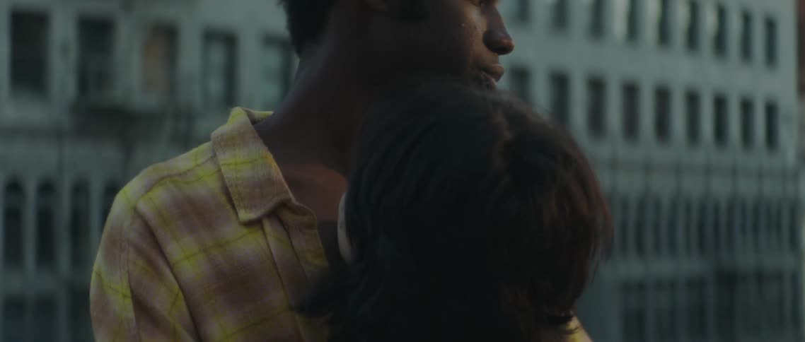 Couple hugging outdoors