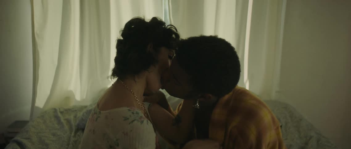 Couple kissing on bed