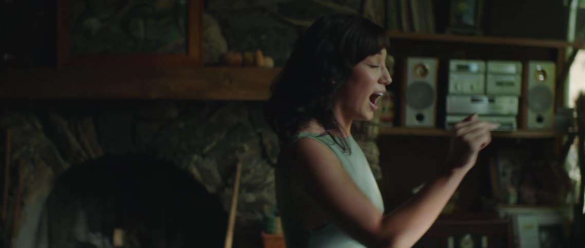 A woman is screaming at someone in the room