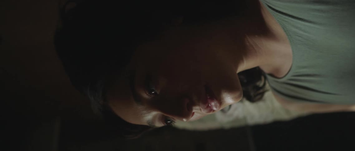 A woman stares straight ahead as the vehicle shes riding in flips around