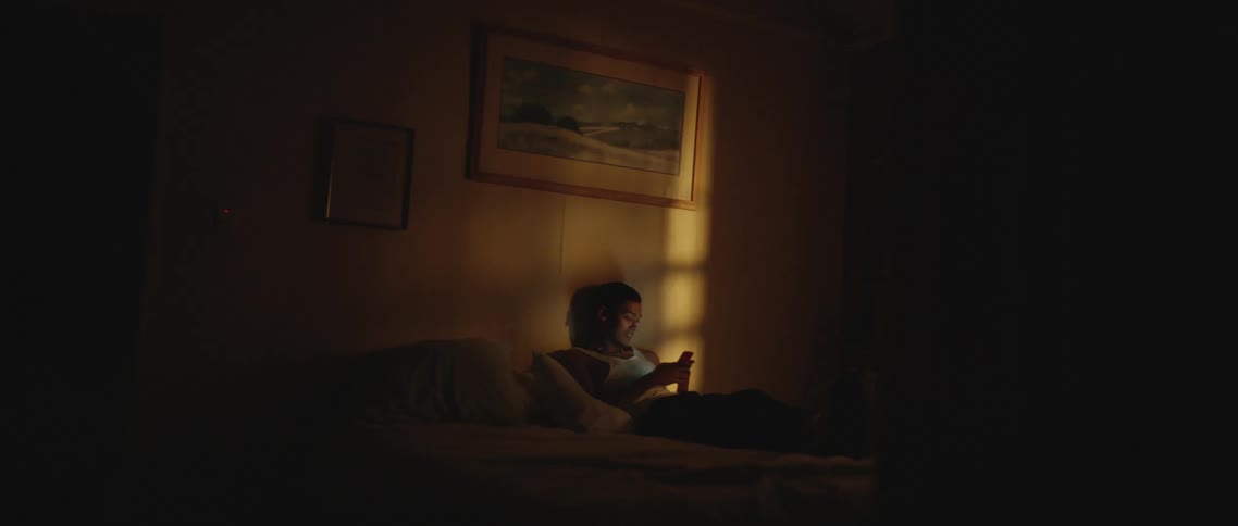 Person lying on bed