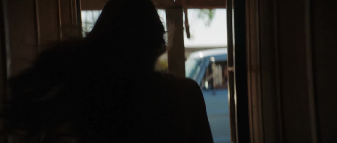 A woman running to a pickup