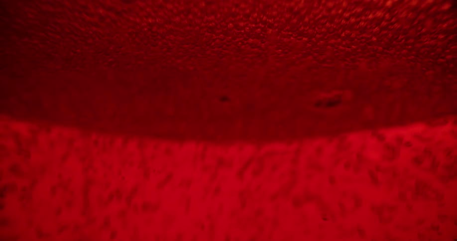 A red liquid with bubbles