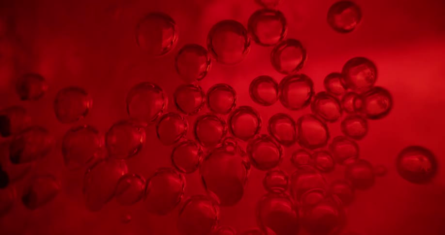 Red bubbles in a red liquid