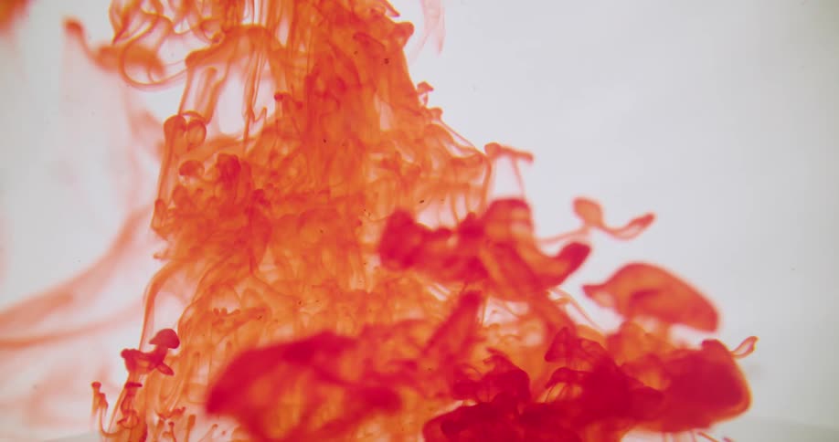 A red liquid spinning and mixing