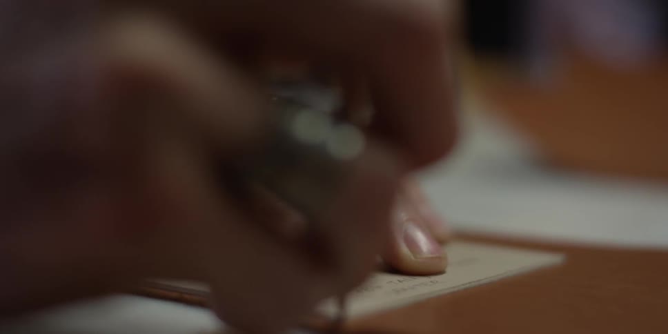 A man traces a form on a piece of material
