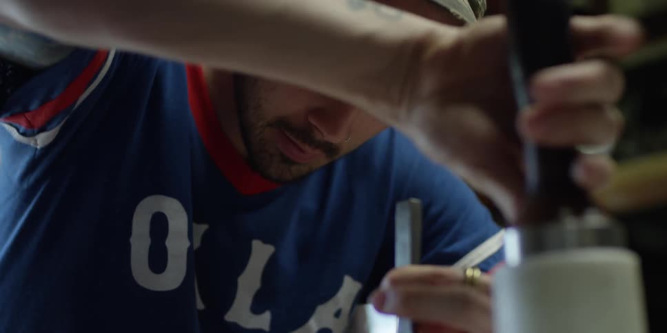 A man uses a tool to work