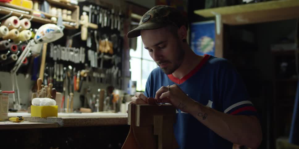 A man is working in a shop