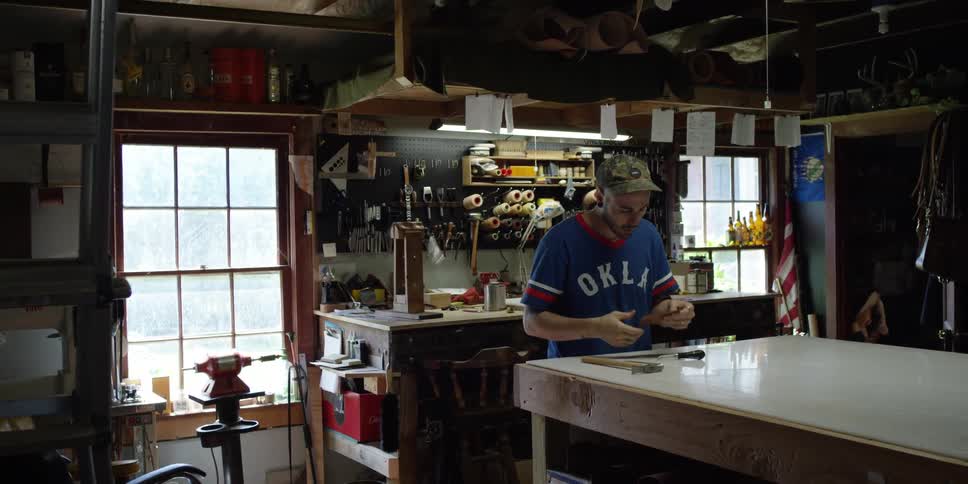 A man is working in a shop