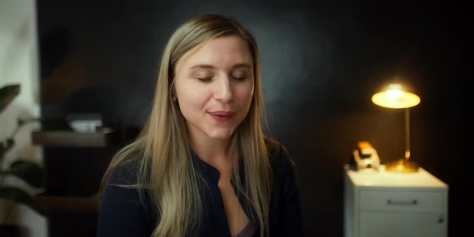 A woman sitting in an office