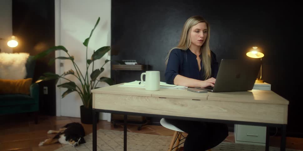 A woman using a laptop in the office