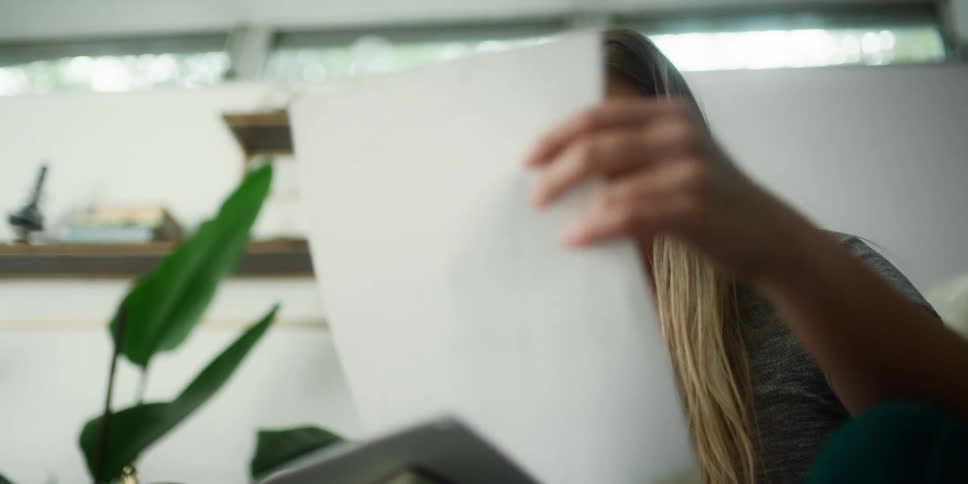 A woman sorting through papers