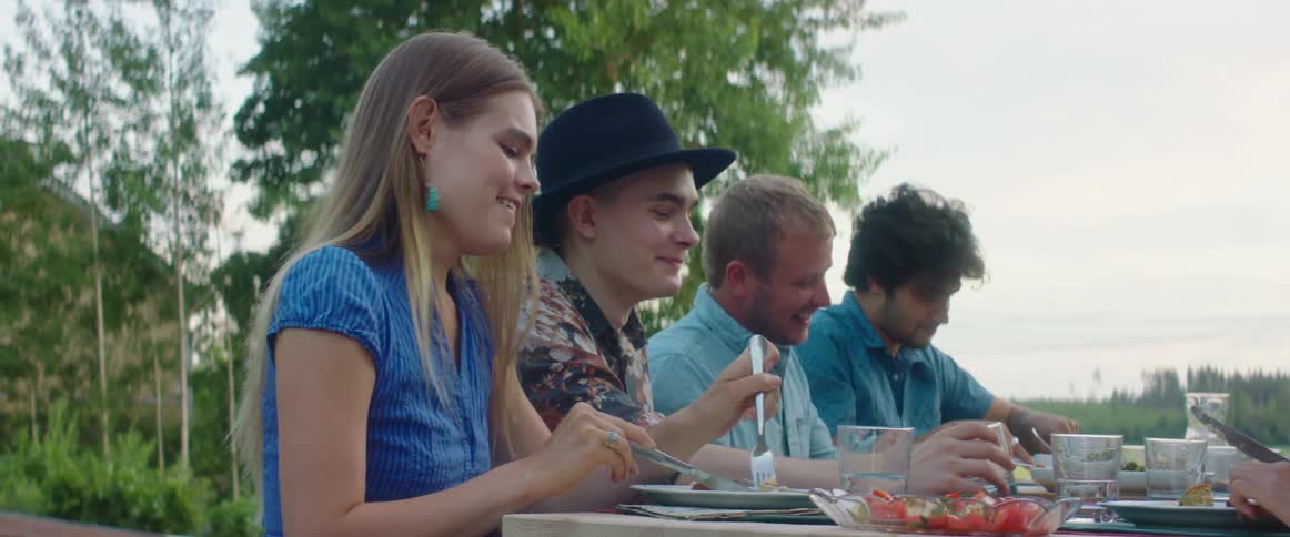 A group of people sitting around at a party together