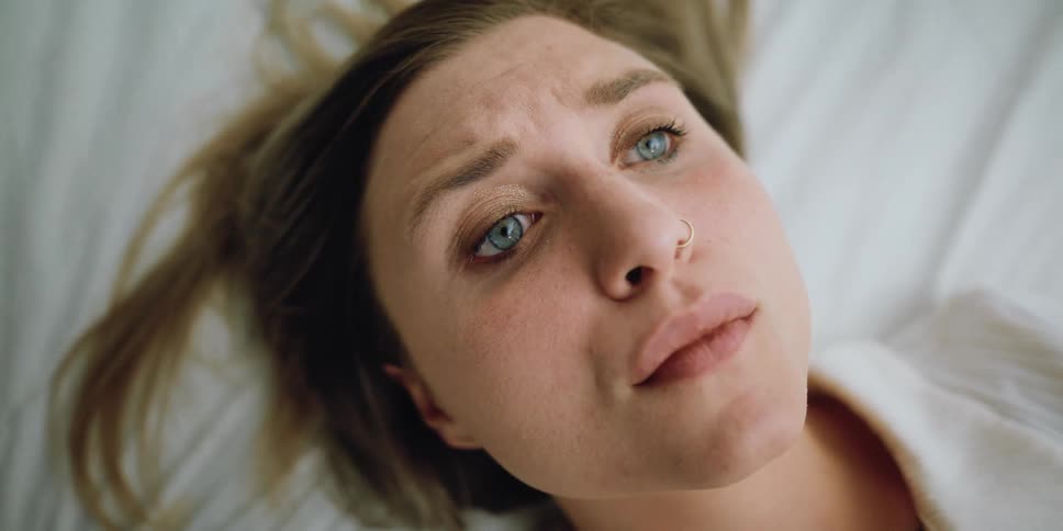 Woman lying on bed