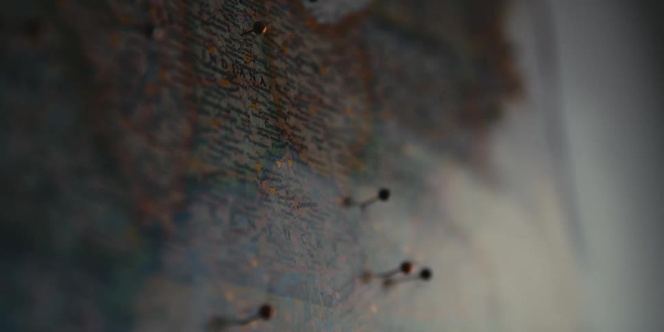 Pins stuck in a map marking locations