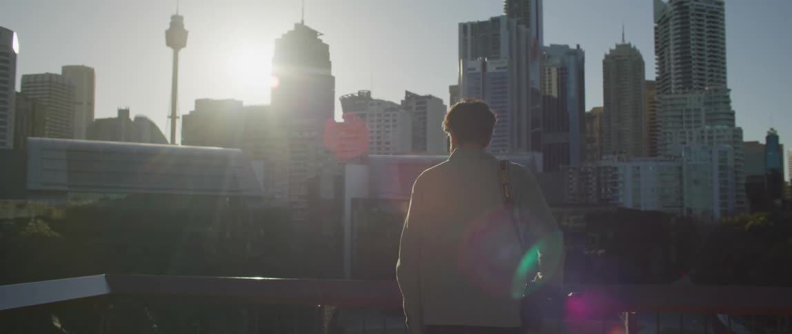 A man walks on the roof to look at the skyline