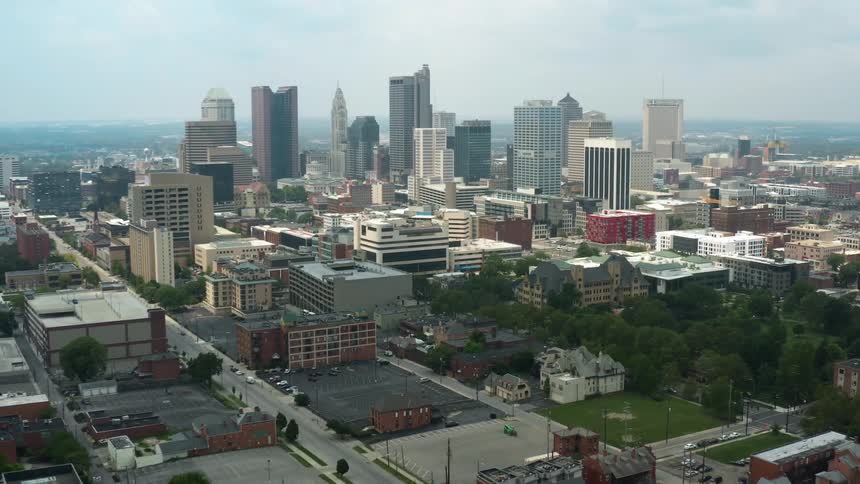Aerial view of city skyline with tall buildings and parks