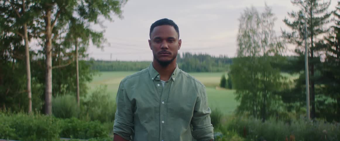A portrait of a man standing outdoors