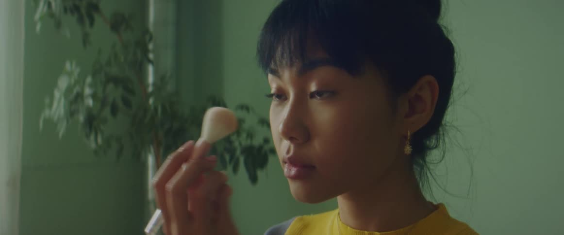 Woman putting on makeup