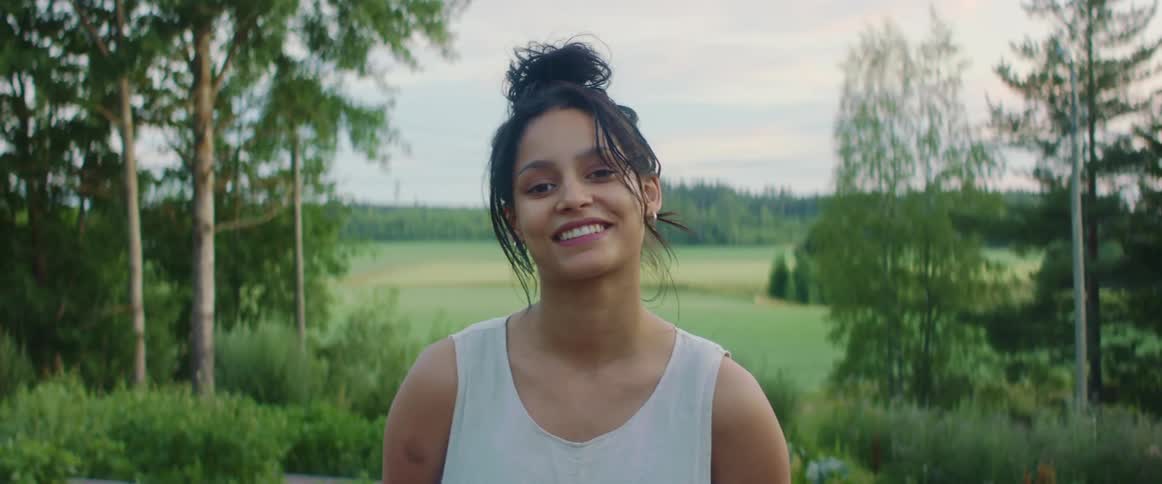 A woman smiling and posing