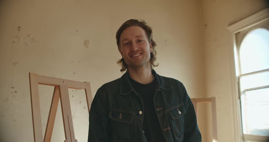 A man standing and smiling