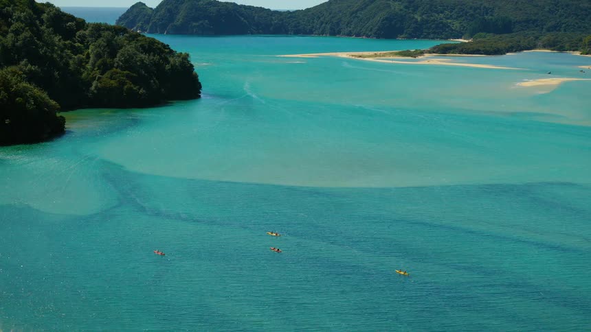 People are rowing between the islands