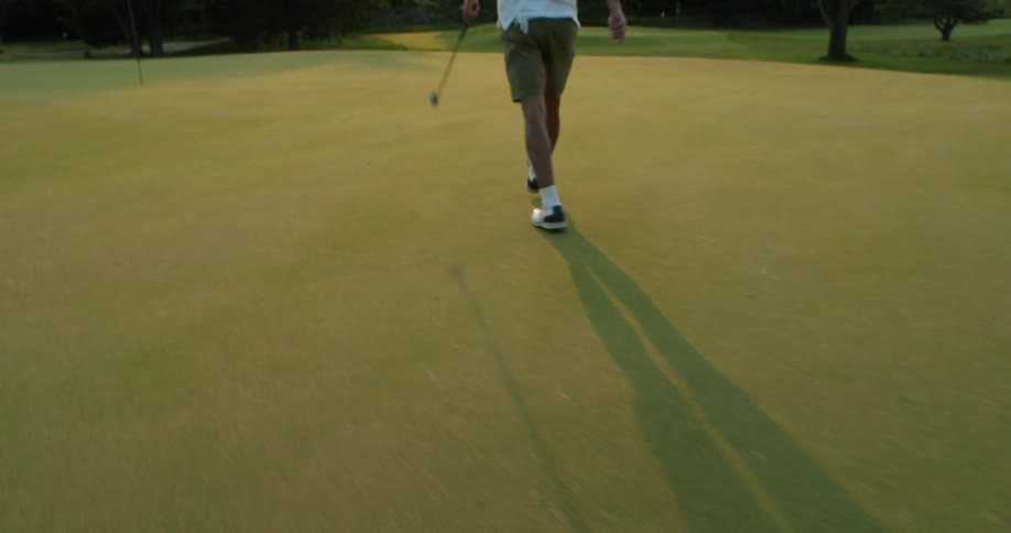 Golfer walking forward