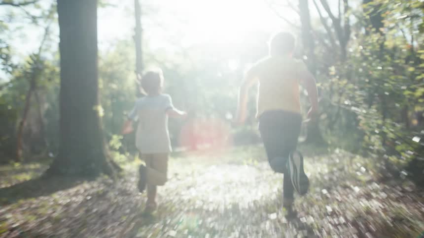 Two children playing and running outdoors