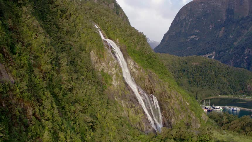 An aerial view of a waterfall on a mountain