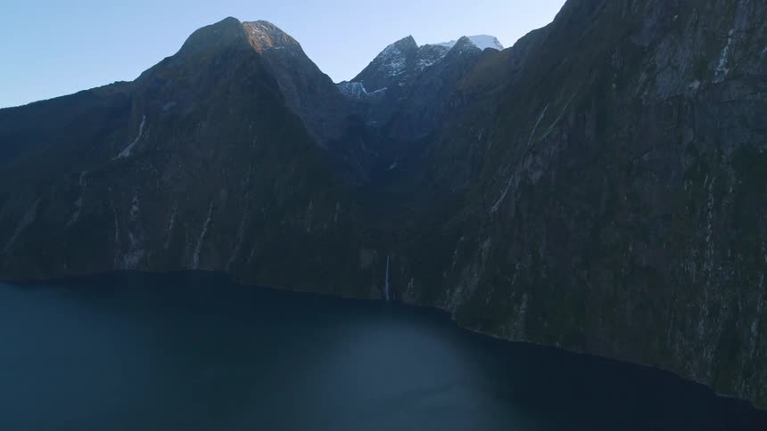 Icy mountain peaks surround a lake