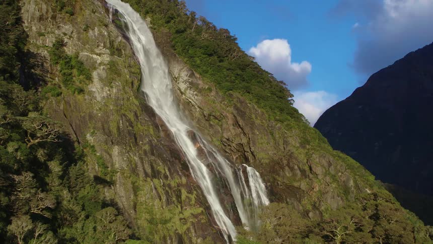 Waterfall streaming down the side of a mountain