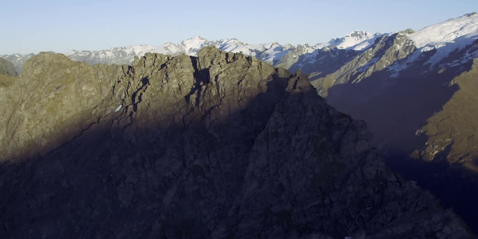 The mountain range is covered with fog and snow