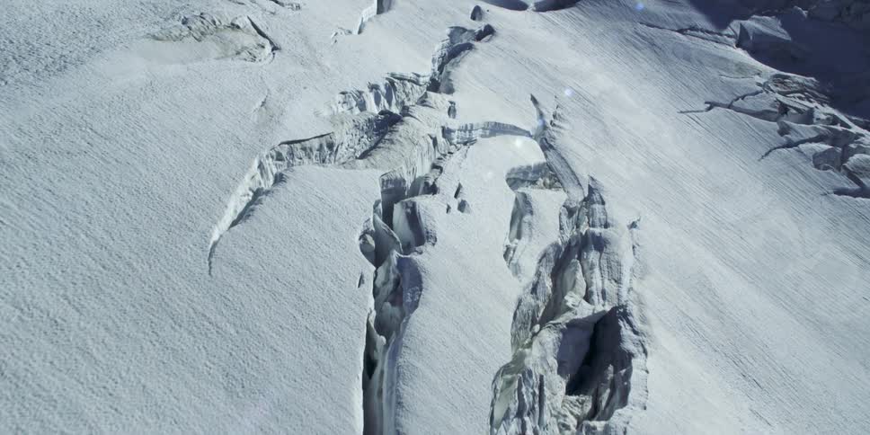 A snowy mountain slope during the day
