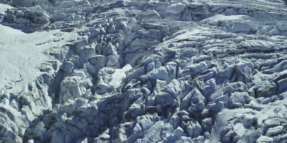 Cracks crisscross a glacier ice fall
