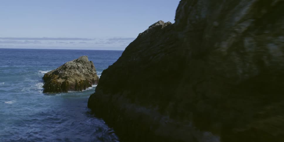 Waves hit the sea stacks