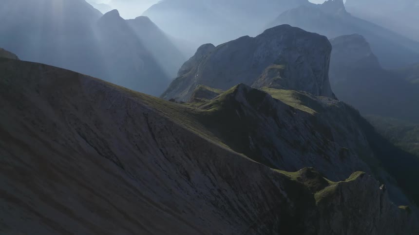 The sun is shining over the mountains