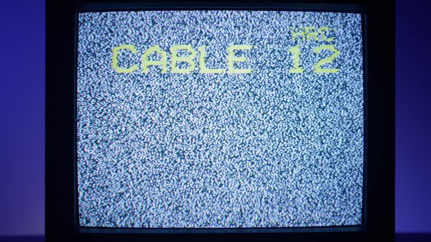 White static is displayed on the television