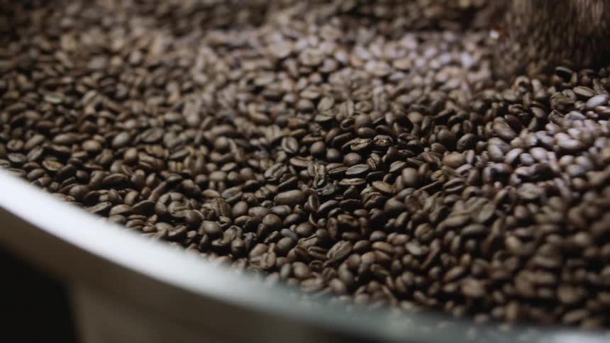 Coffee beans churning in a roaster