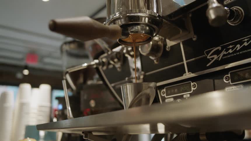 Coffee coming from coffee machine