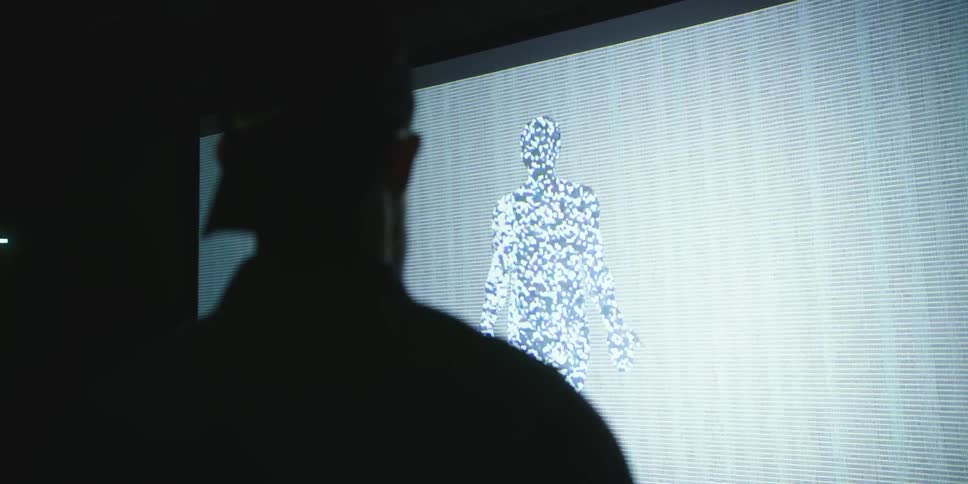 A man looking at a screen